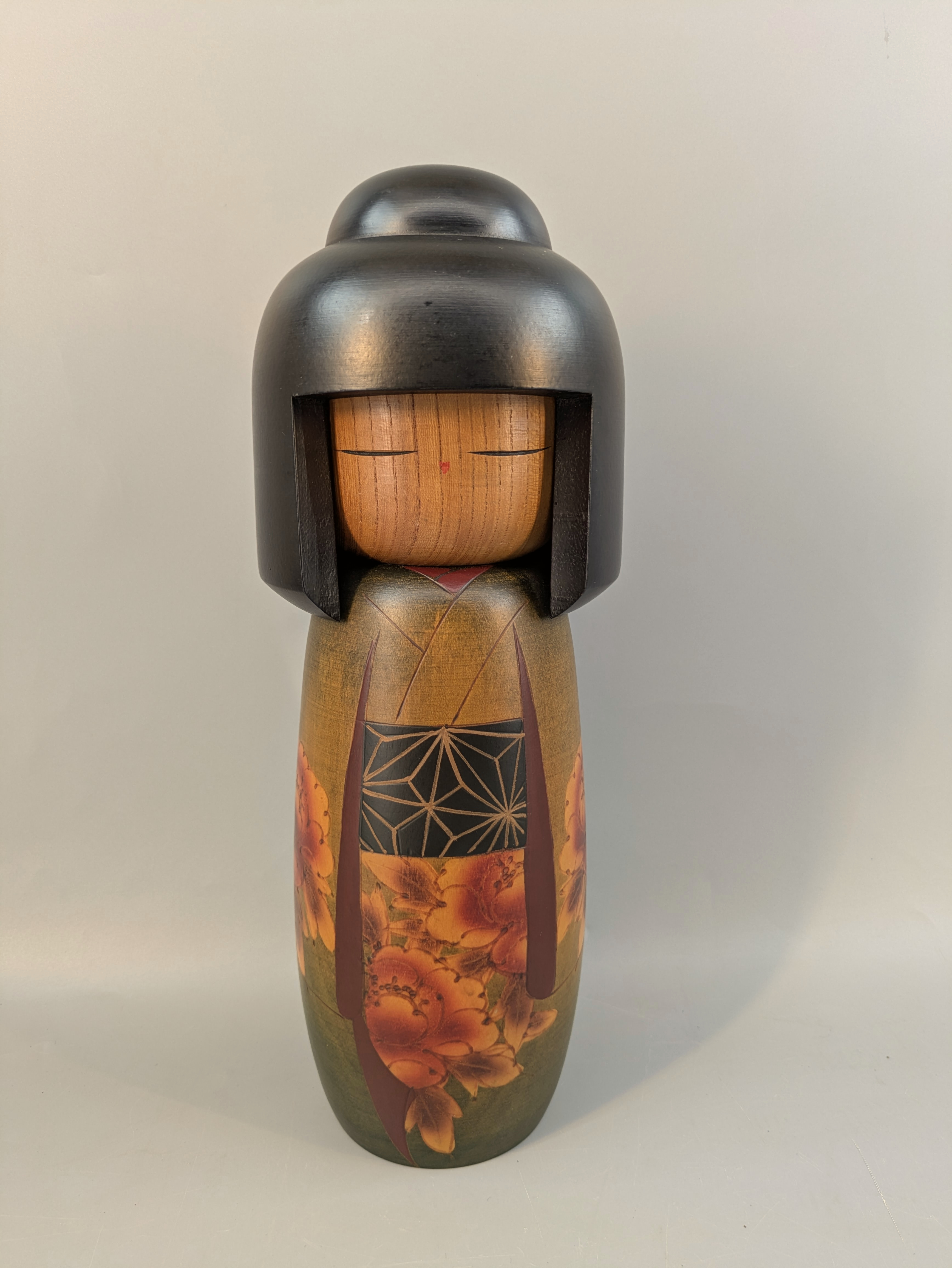 Full painted Japanese wooden doll with floral decoration